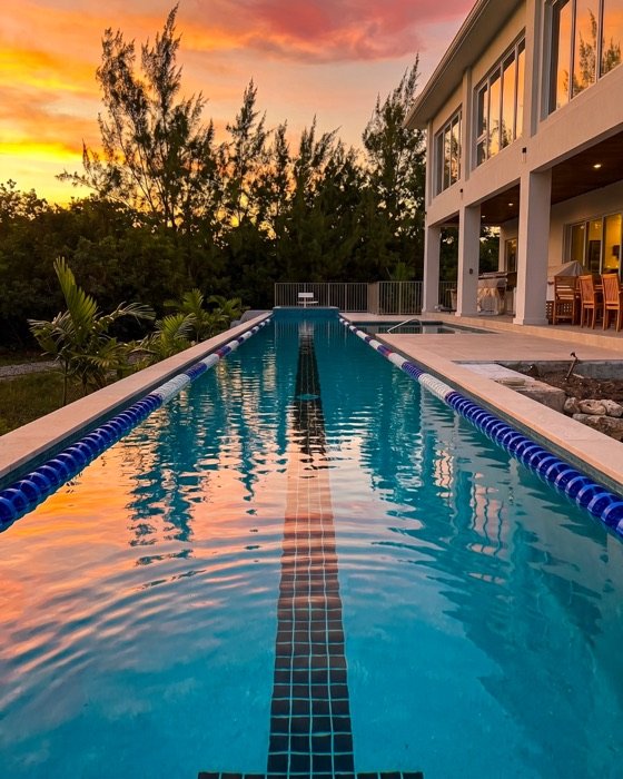 Lap pool at sunset on a J&R Construction project